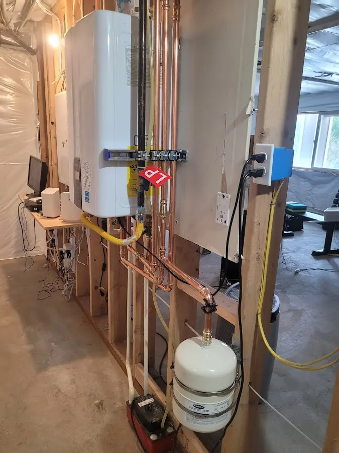 Licensed plumber repairing a kitchen sink in Oswegatchie